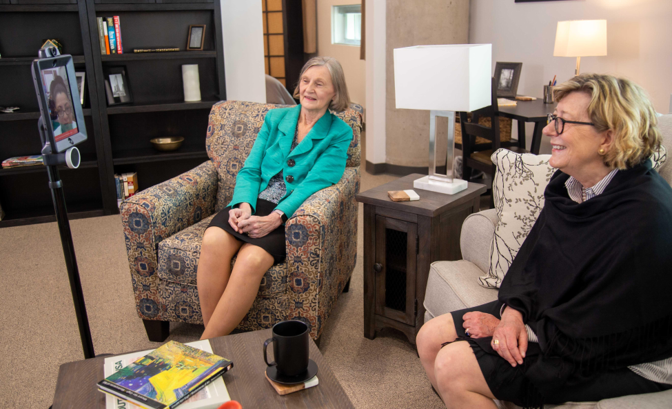 Cizik School of Nursing at UTHealth professors Joanne Hickey, PhD, RN, and Constance Johnson, PhD, RN, demonstrate robotic monitoring technology in the Smart Apartment.